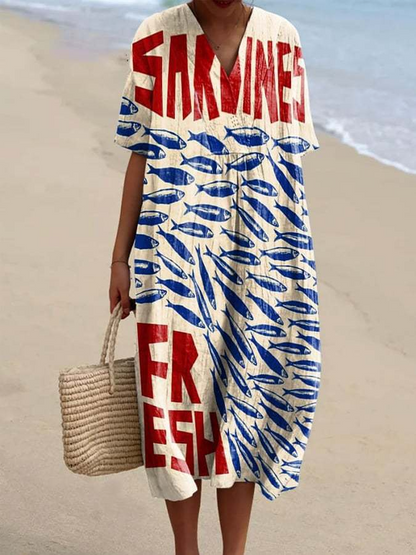 Kasandra - Sukienka z lejącym się materiałem z marynistycznym wzorem