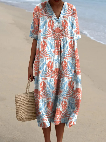 Kasandra - Sukienka z lejącym się materiałem z marynistycznym wzorem